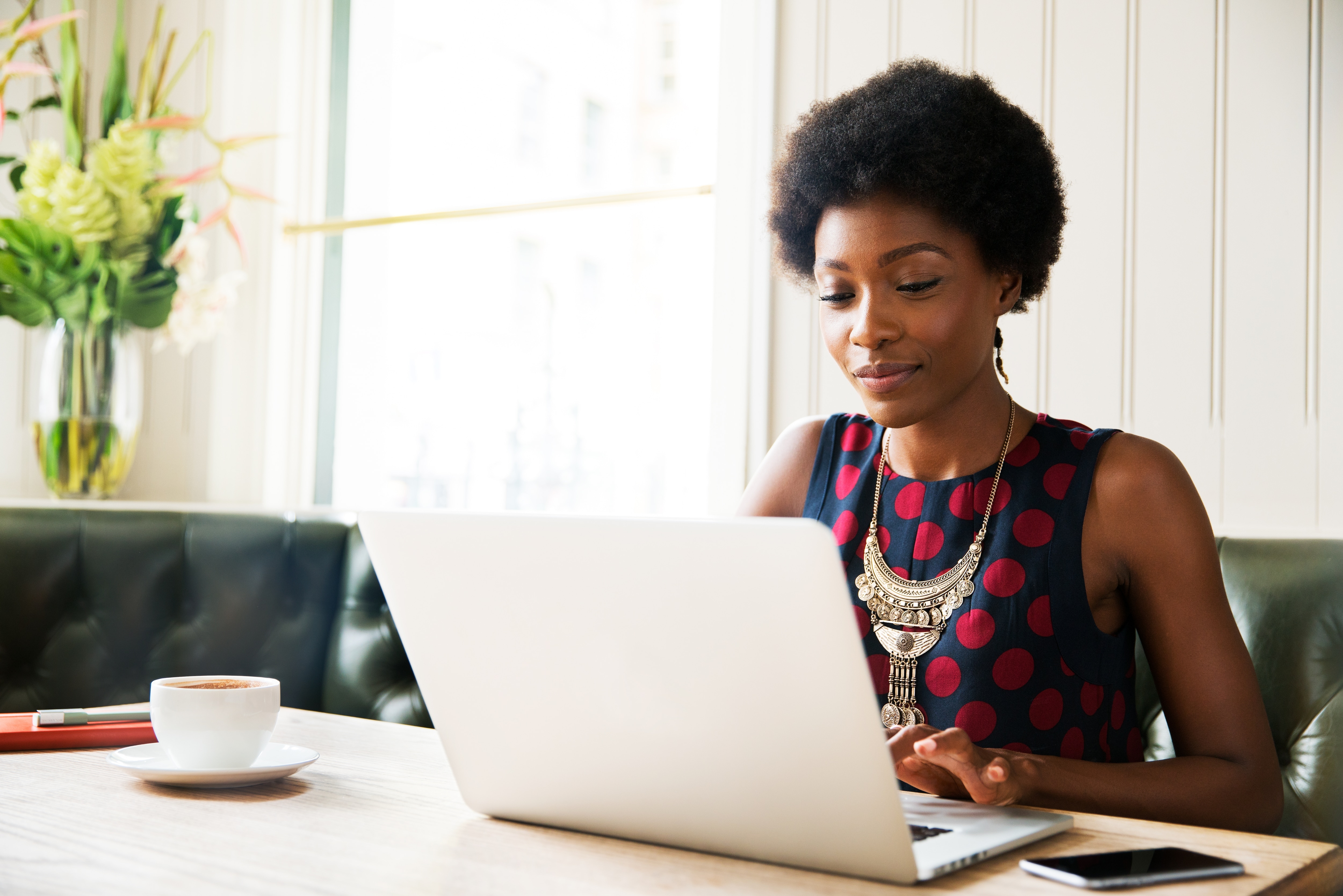 a business woman sitting at the desk