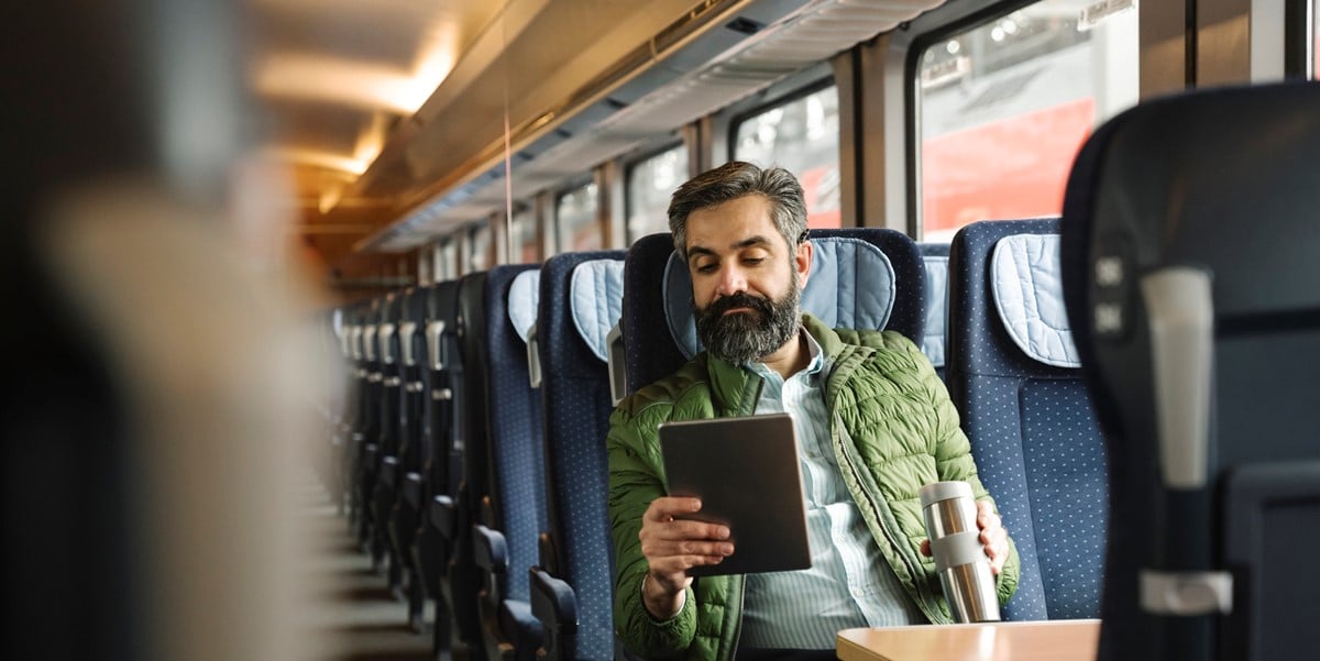 man travelling on train